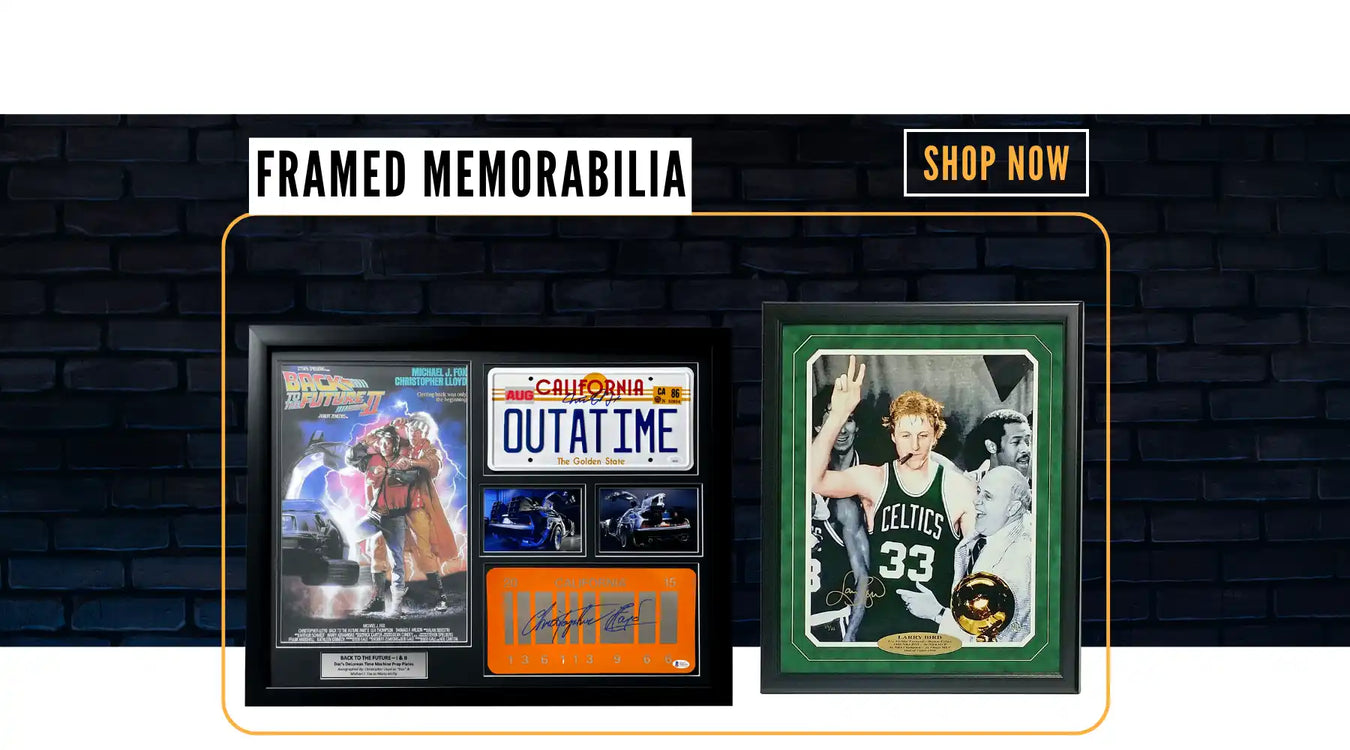 Framed sports memorabilia display featuring basketball and movie collectibles.